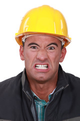 Angry builder grimacing