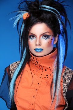 Makeup. Punk Hairstyle. Close up portrait of Rock girl with Blue