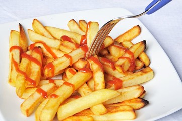 French fries with tomato sauce © Arena Photo UK