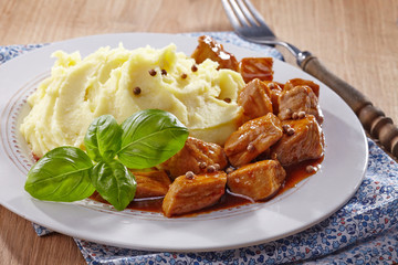mashed potatoes and meat stew