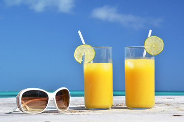 Sunglasses and orange juice