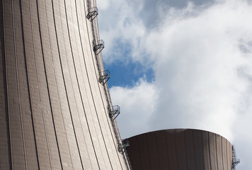 Nuclear power plant against  clouds and sky