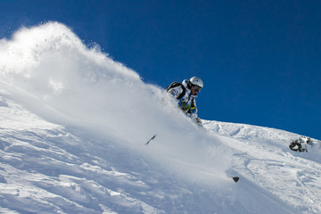 Naklejka na ściany i meble Skier in soft snow