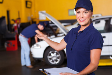 friendly female vehicle service center worker welcome
