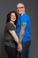 Happy young couple in love together. Studio shot.