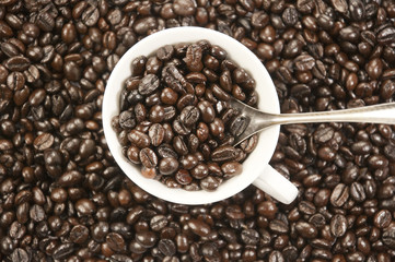 A cup of coffee and coffee beans background