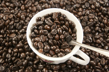 A cup of coffee and coffee beans background