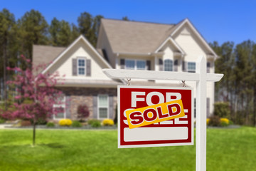 Sold Home For Sale Real Estate Sign and House