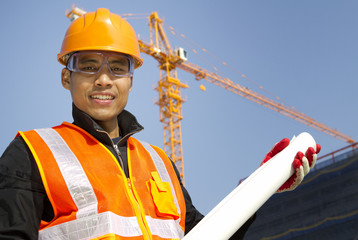 Portraite site manager with safety vest under construction