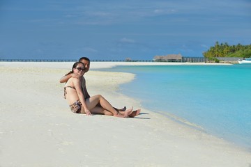 asian couple enjoying summer on beach