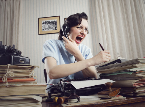 Woman shouting into telephone