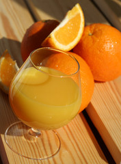 fresh orange juice and oranges