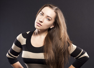 Fototapeta premium positive female. dark studio background