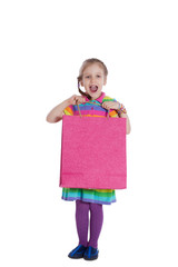 Surprised little girl with paper pack