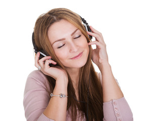 Naklejka premium Young Woman Listening To Music