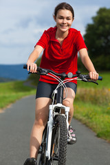Fototapeta na wymiar Healthy lifestyle - girl biking