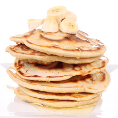 Pancakes with bananas and syrop