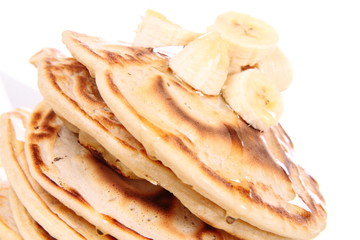 Pancakes with bananas and syrop