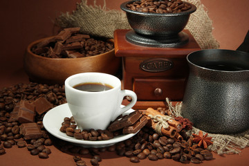 cup of coffee, grinder, turk and coffee beans
