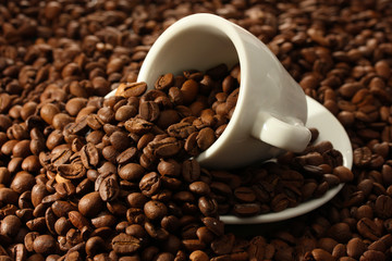 Cup with coffee beans, close up