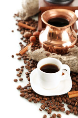 Cup and pot of coffee and coffee beans, isolated on white