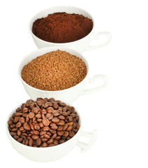 Different types of coffee in three cups isolated on white