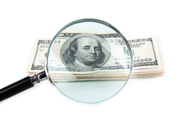 Hundred dollar bill and magnifying glass isolated on white - obrazy, fototapety, plakaty