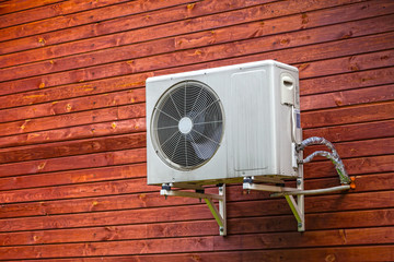 Air conditioner on the wall of boards.