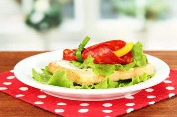 Salami rolls with paprika pieces inside,