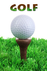 Golf ball on grass on white background
