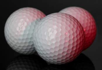 Golf balls on grey background