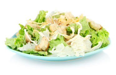 Caesar salad on blue plate, isolated on white