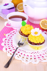 Beautiful lemon cupcakes and flavored tea