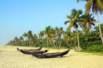 Poster old fishing boats on beach in india © Kokhanchikov