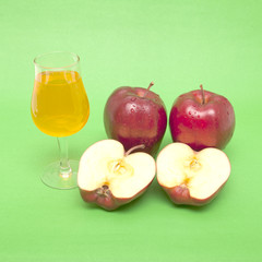 red apple close-up isolated on green background