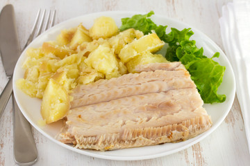 boiled fish with potato and lettuce