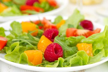 salad with raspberries on plate