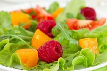 Obraz na płótnie Canvas salad with raspberries and orange