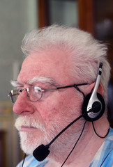 a senior man wearing headphone