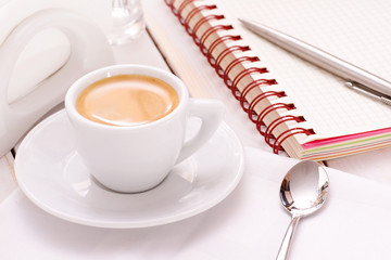 Coffee with notebook and pen