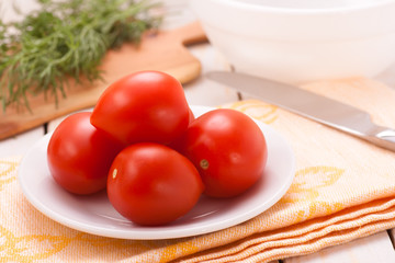 Plum tomatoes on plate