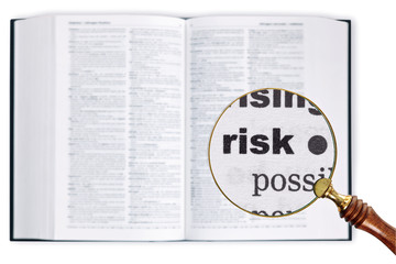 Risk through a magnifying glass over Dictionary.