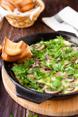 breakfast of scrambled eggs with mushrooms