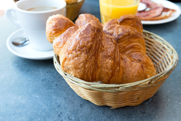 Breakfast with coffee and croissants
