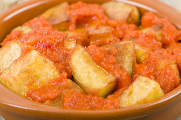 Patatas Bravas - Crispy potato chunks in spicy tomato sauce.