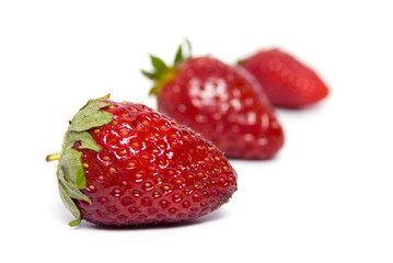 Three strawberries isolated on white