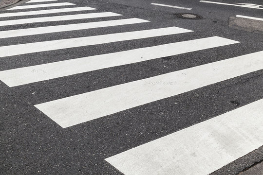 pedestrian crossing marked with white paint