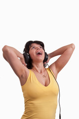 woman listening to music on headphones enjoying a dance