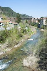 Fototapeta premium Small italian village and railway bridge