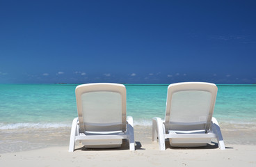 Two sunbeds overlooking Atlantic. Exuma, Bahamas
